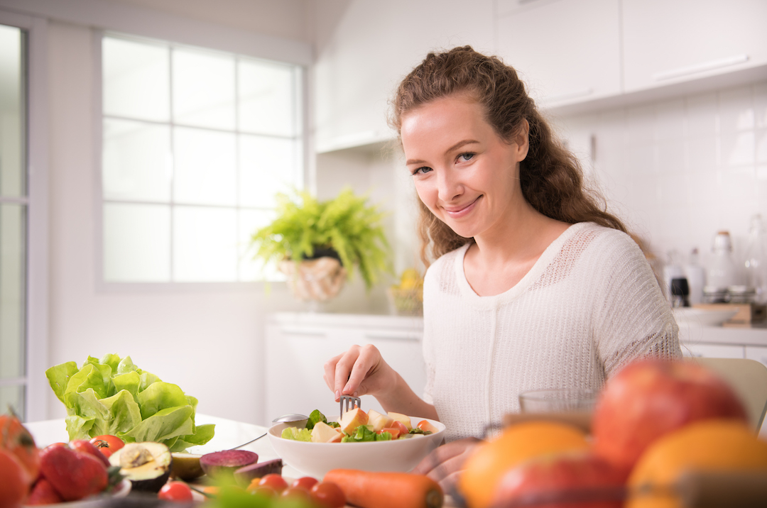 Lady smiling at the camea | Featured Image for the Do Dentures Affect Taste Blog by Denture Health Care.